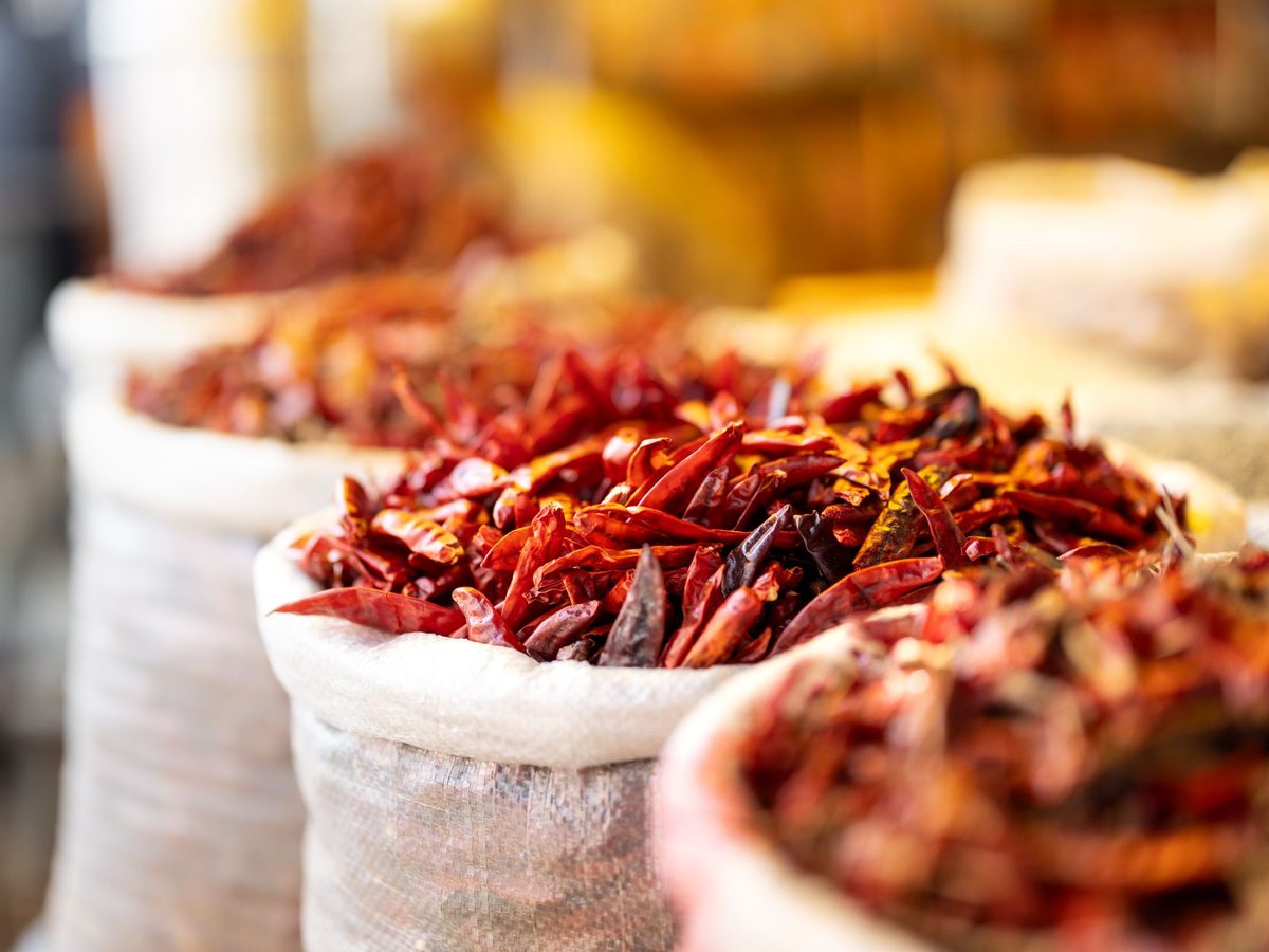 Sacks of dried red chillies at a market yard